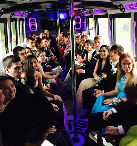 teenagers in bus on their way to the prom